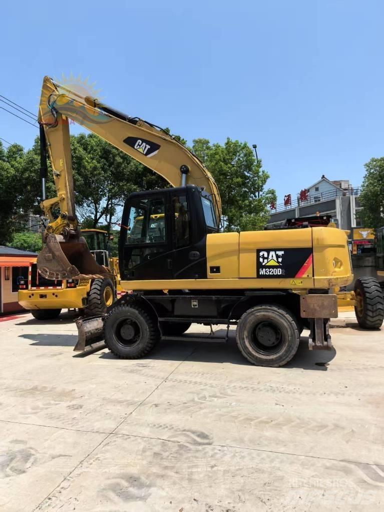 CAT M 315 D2 Escavatori gommati