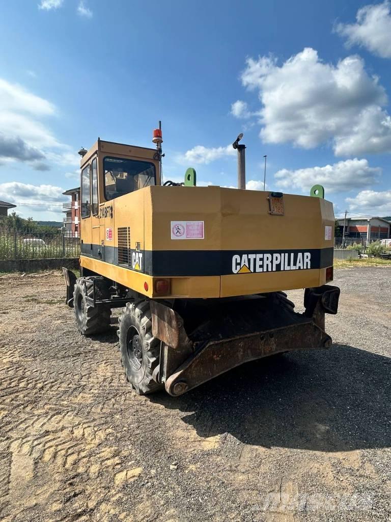 CAT 214 Escavatori gommati