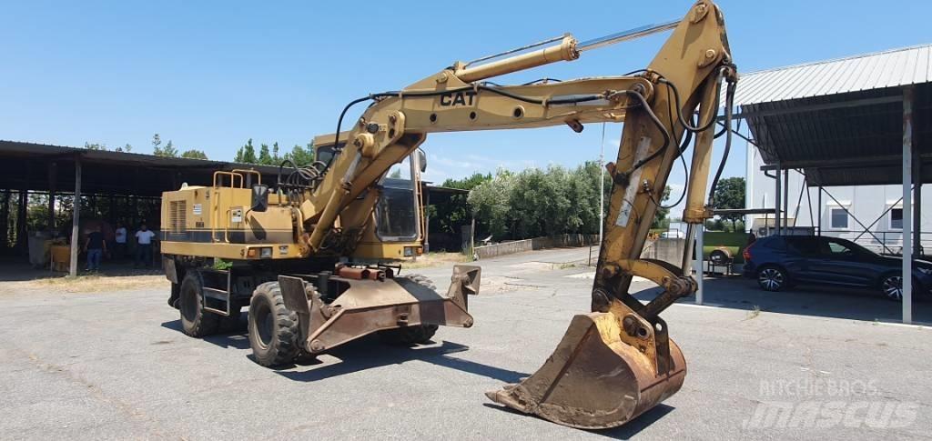 CAT 214 B Escavatori gommati