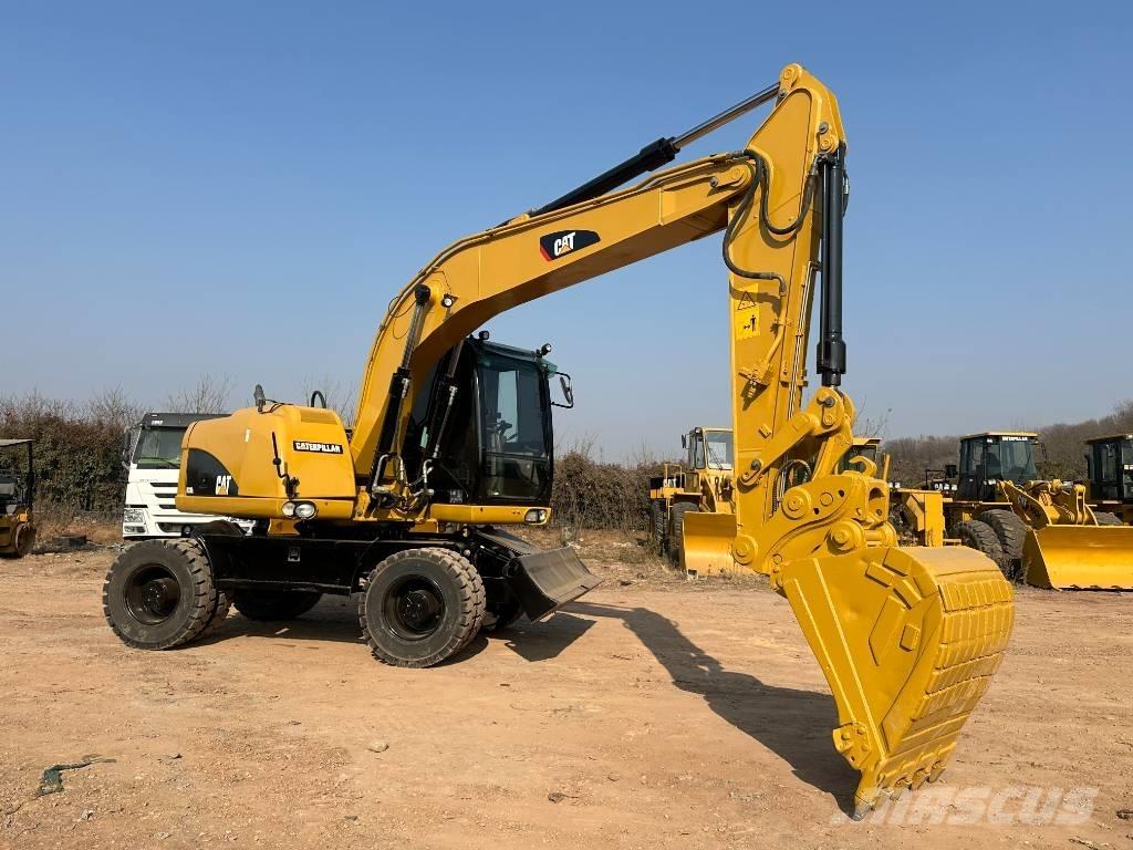 CAT M 320D Escavatori gommati