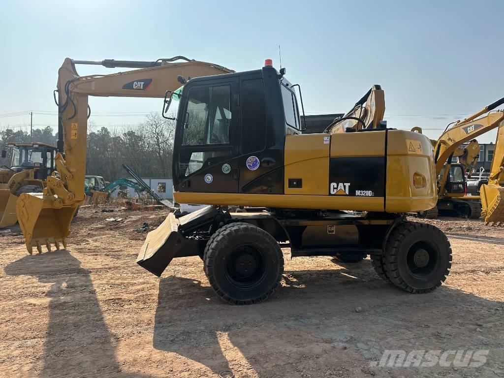 CAT M 320D Escavatori gommati