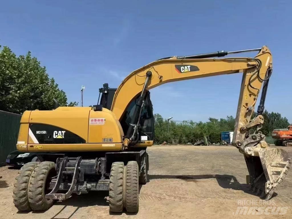 CAT M 315 D Escavatori gommati