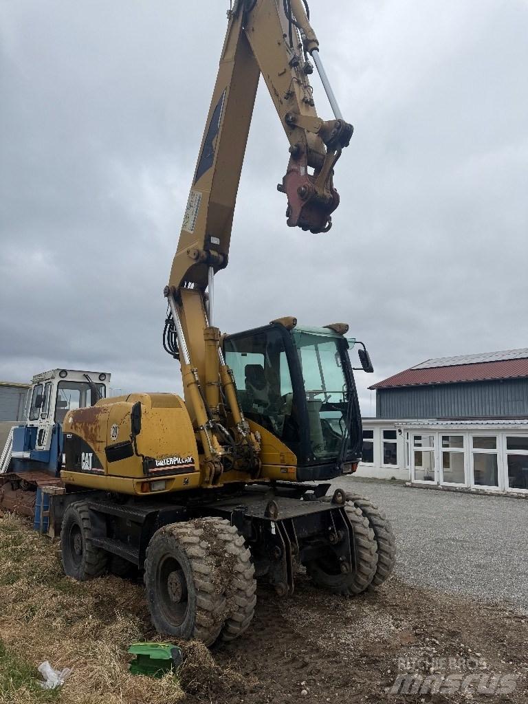 CAT M 313 C Escavatori gommati