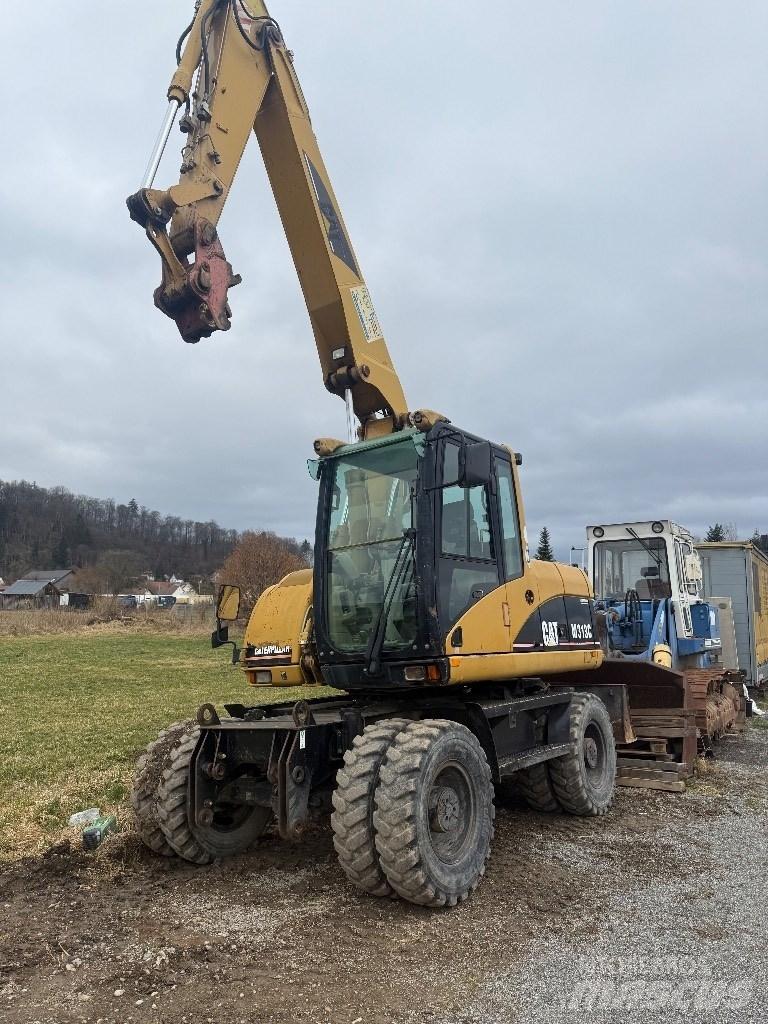 CAT M 313 C Escavatori gommati