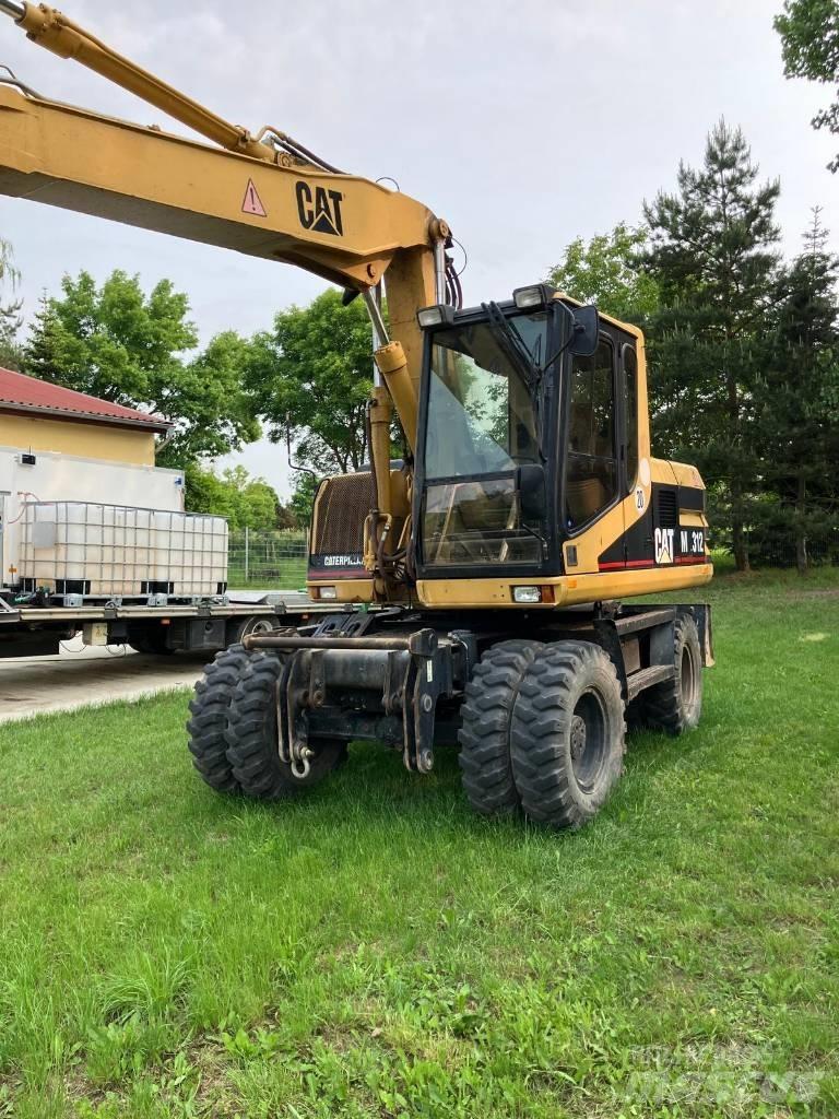 CAT M 312 Escavatori gommati