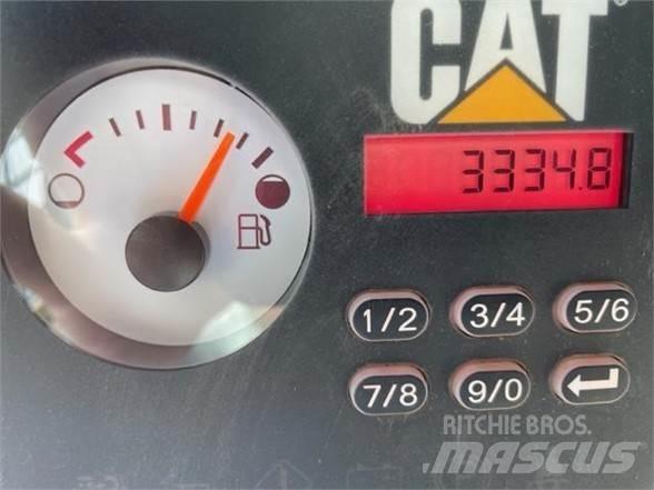 CAT 279D Mini Pale Gommate