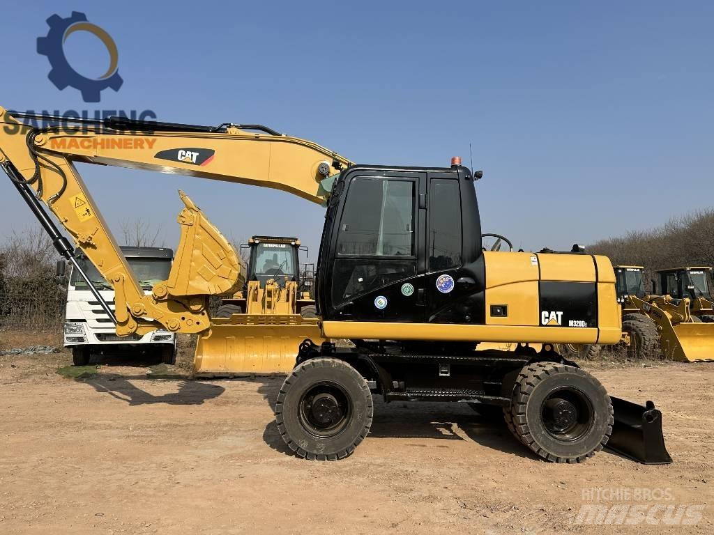 CAT M 320 D2 Escavatori gommati
