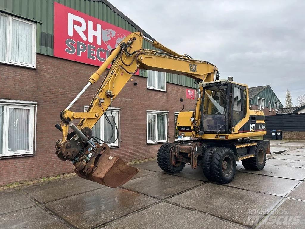 CAT M315 +ROTO CE Escavatori gommati