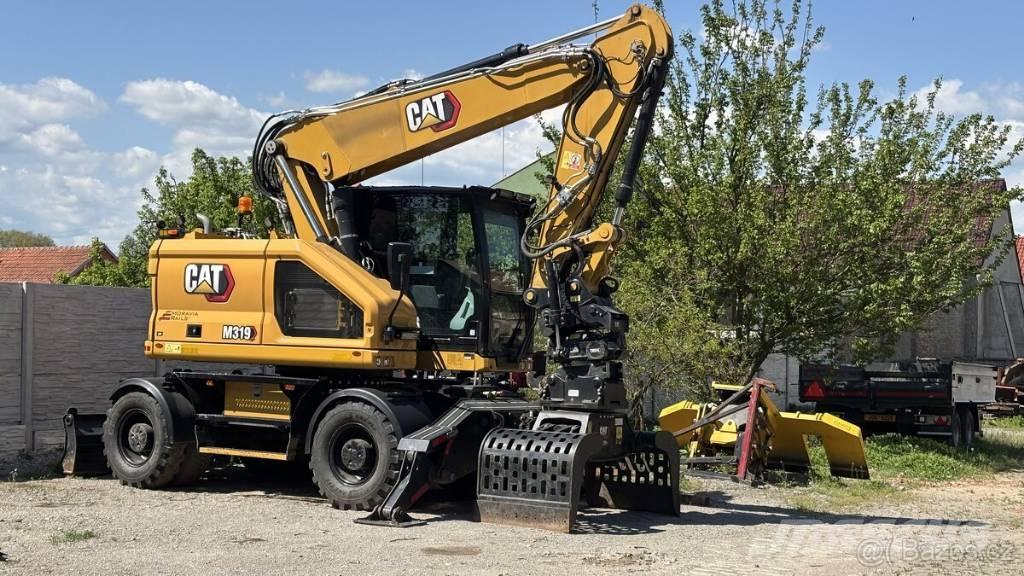 CAT M 319 Escavatori gommati