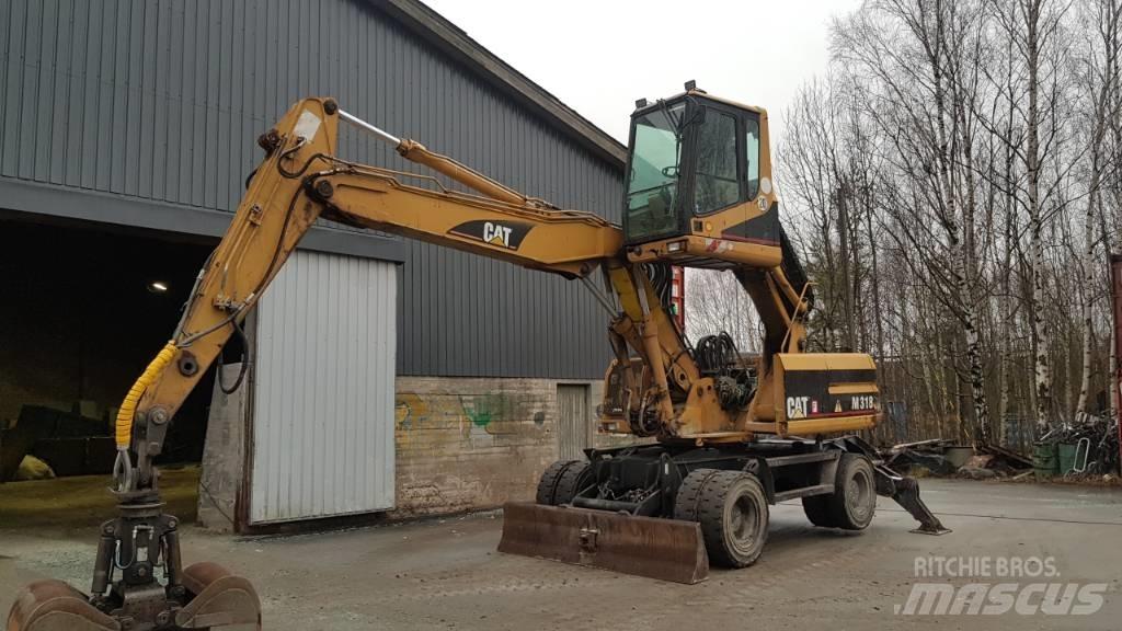 CAT M 318 Movimentazione rifiuti
