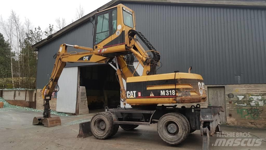 CAT M 318 Movimentazione rifiuti