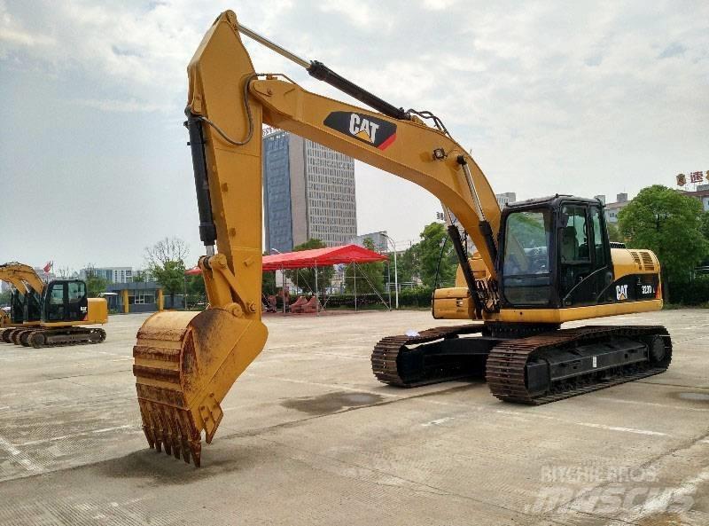 CAT 323 Escavatori cingolati