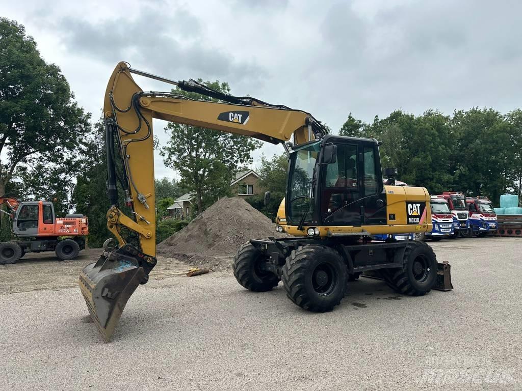 CAT M 313 D Escavatori gommati