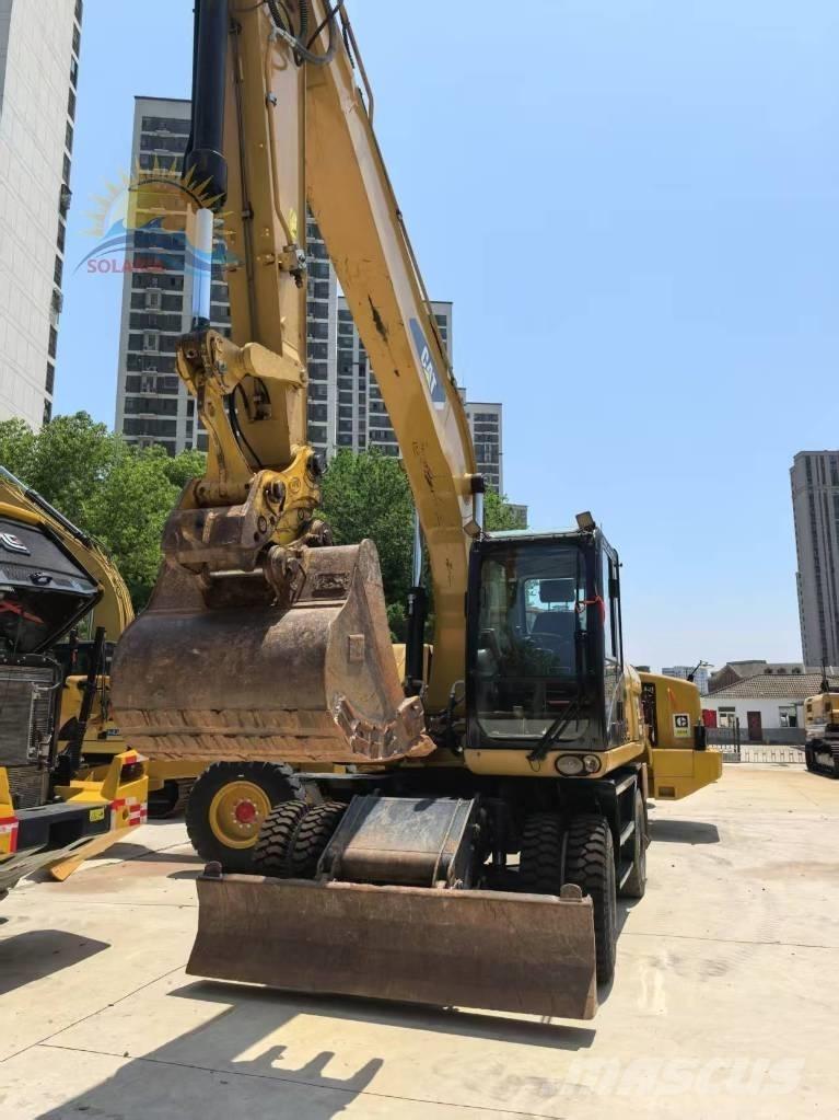 CAT M 320D2 Escavatori gommati