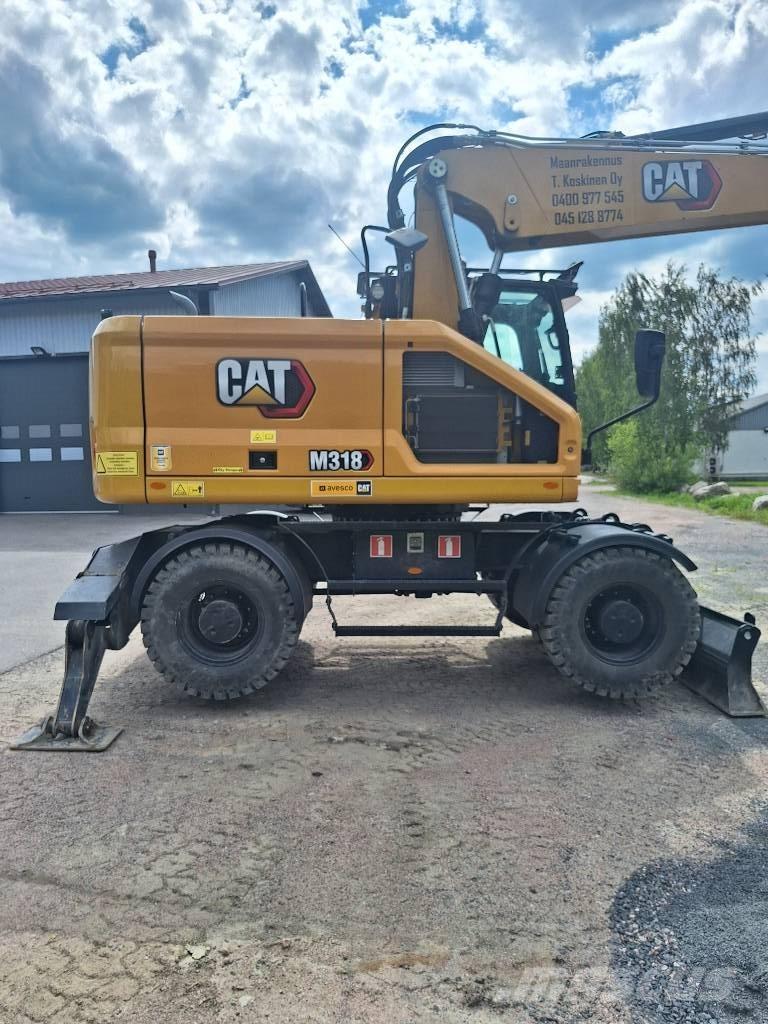 CAT M 318 Escavatori gommati