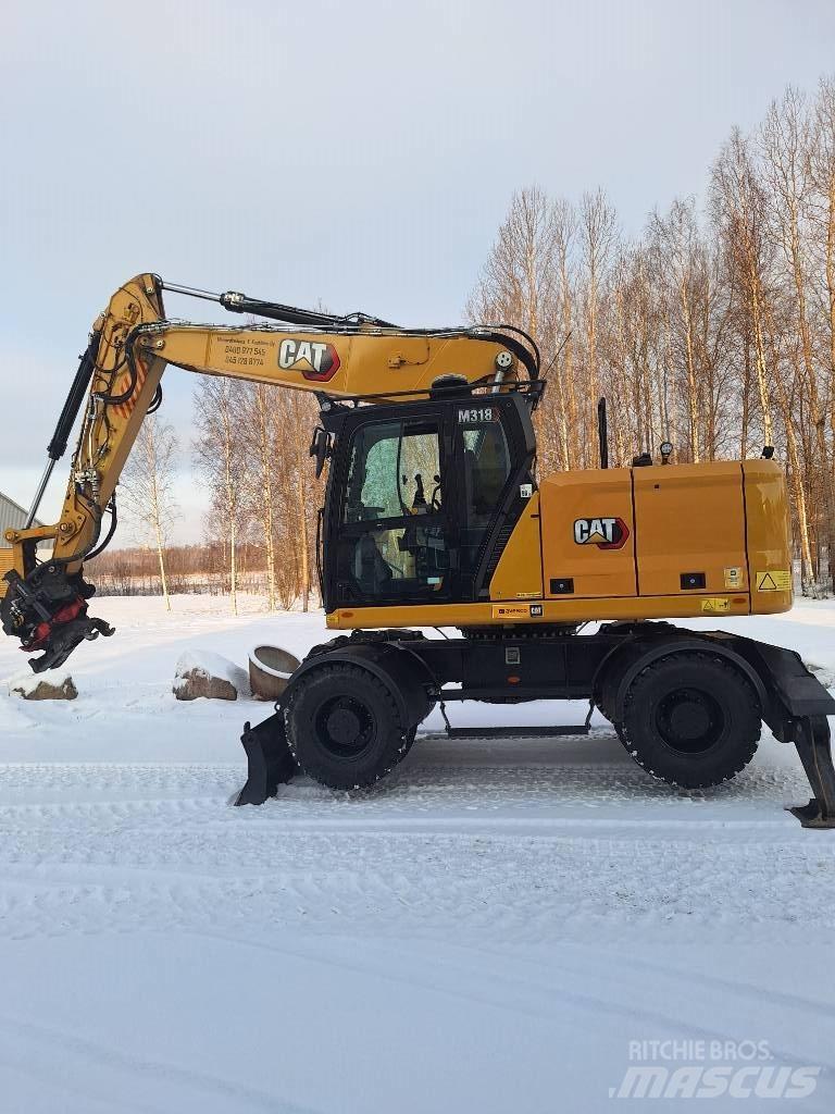 CAT M 318 Escavatori gommati