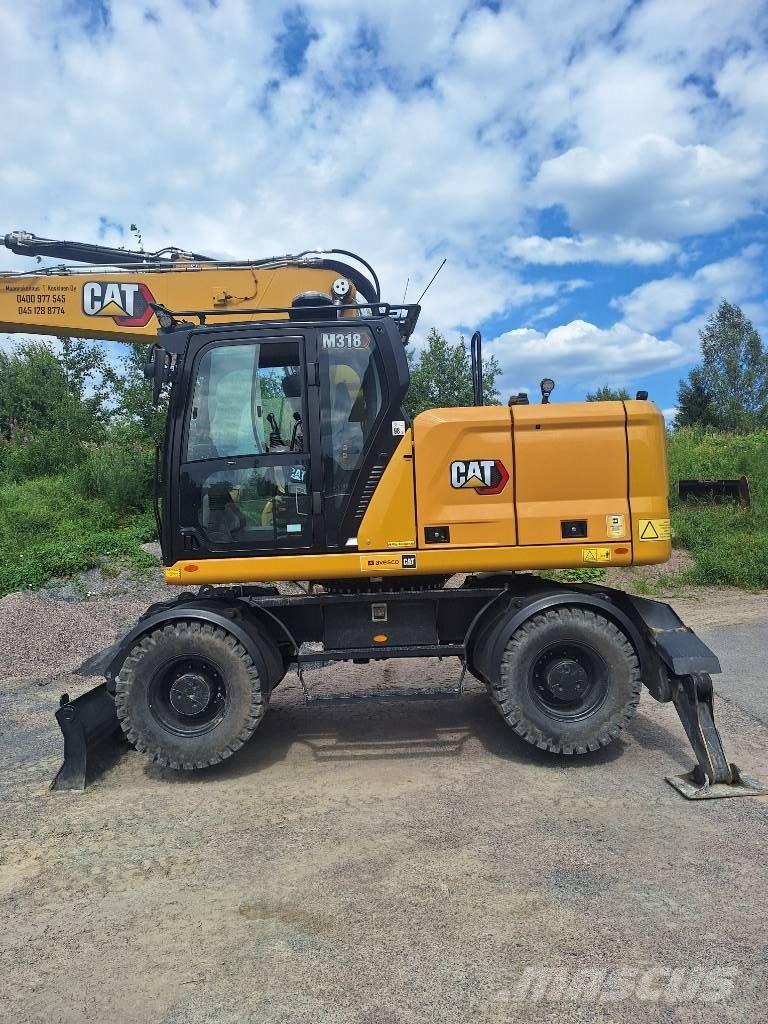 CAT M 318 Escavatori gommati