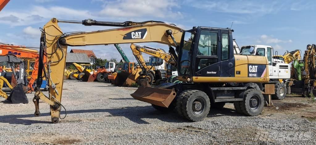 CAT M 315 D Escavatori gommati
