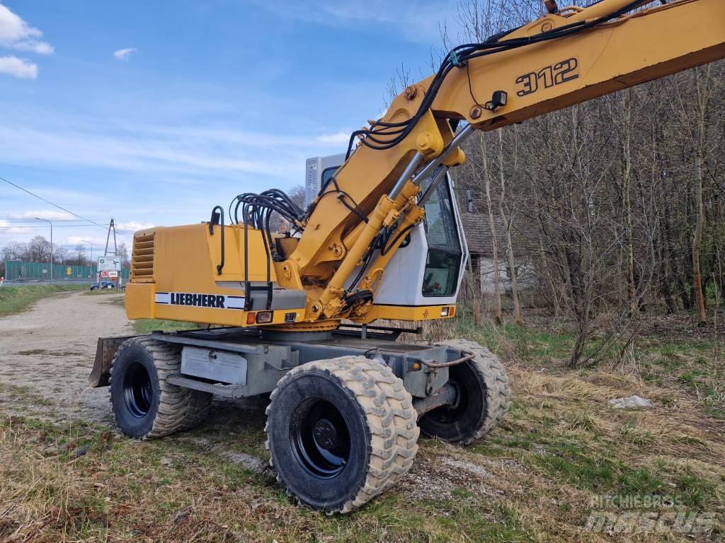 Liebherr 312 A Escavatori gommati