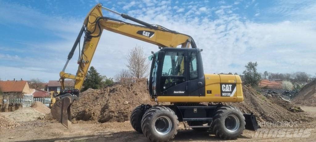 CAT M 313 D Escavatori gommati