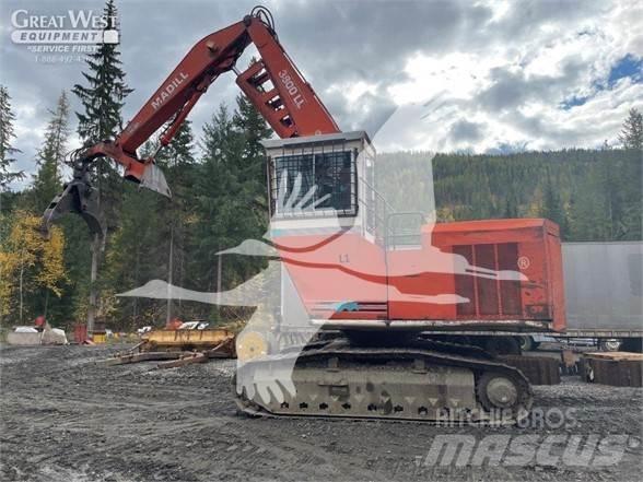 Madill 3800 Caricatronchi con base su rimorchio