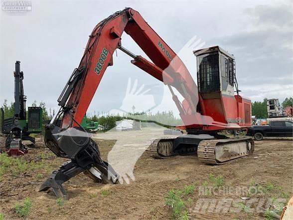 Madill 3800B Caricatronchi con base su rimorchio