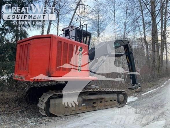 Madill 4000 Caricatronchi con base su rimorchio