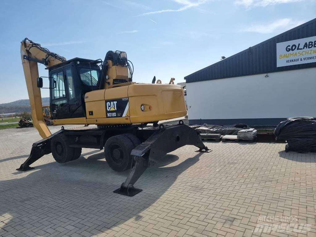 CAT 318D Movimentazione rifiuti