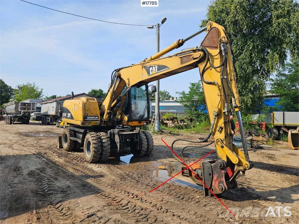CAT M313 C Escavatori gommati