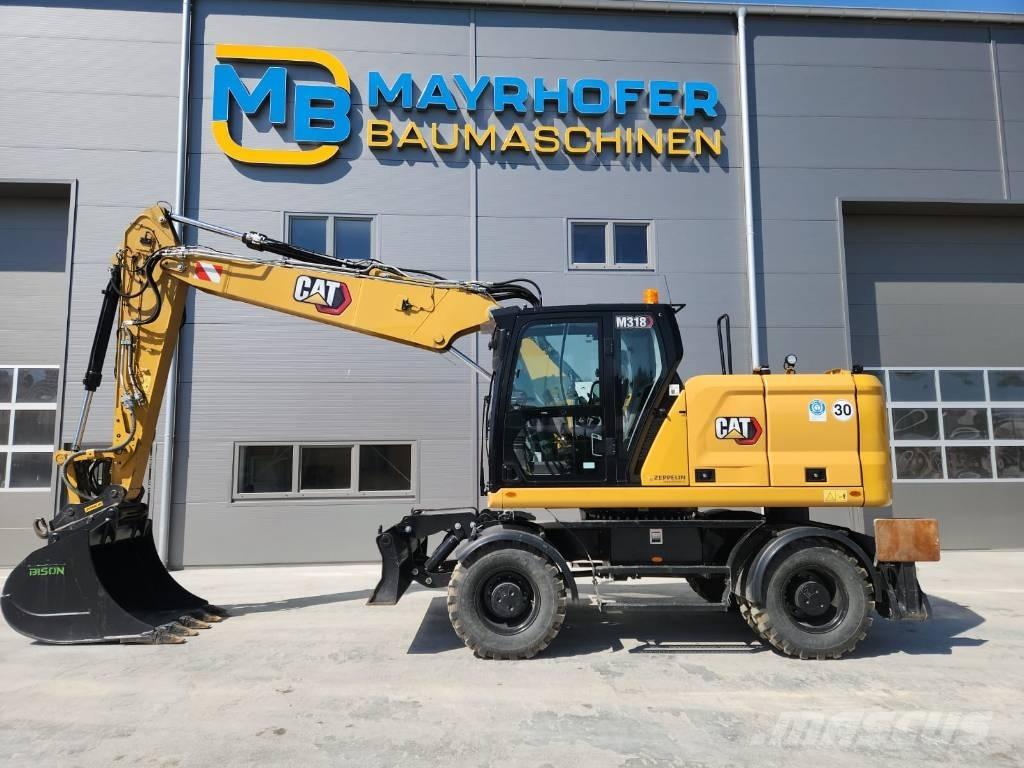 CAT M 318 Escavatori gommati