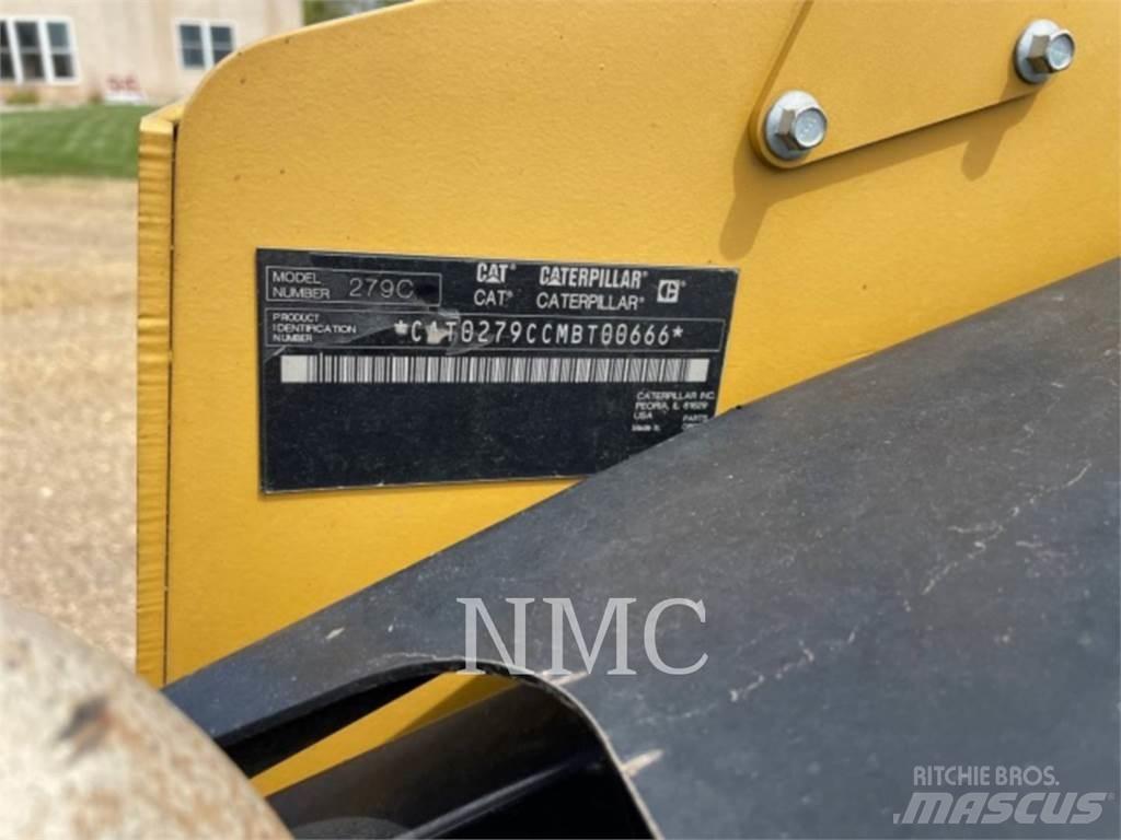 CAT 279C Mini Pale Gommate