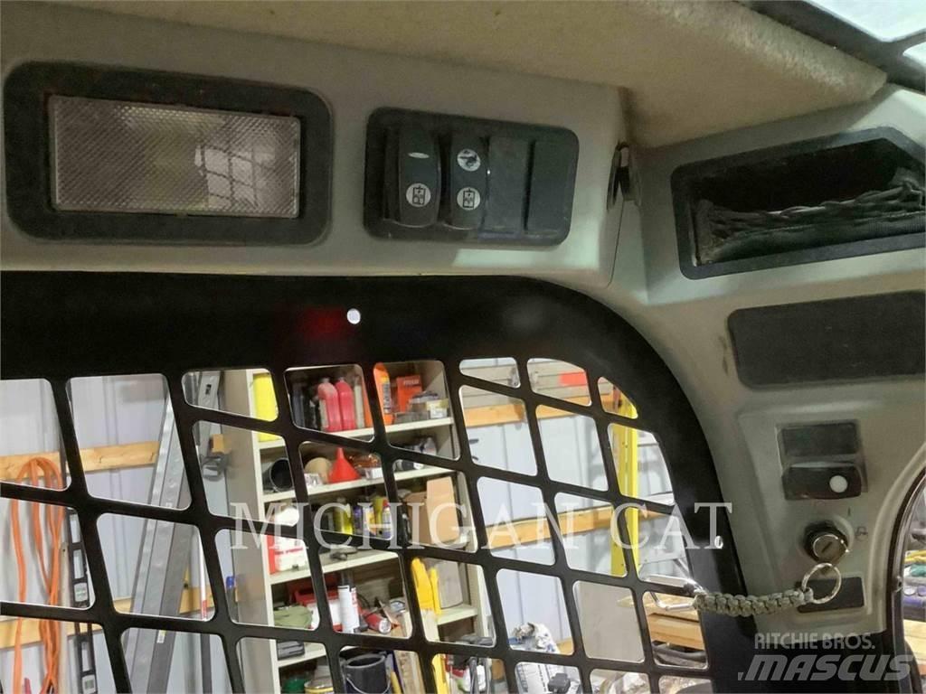 CAT 279D Mini Pale Gommate