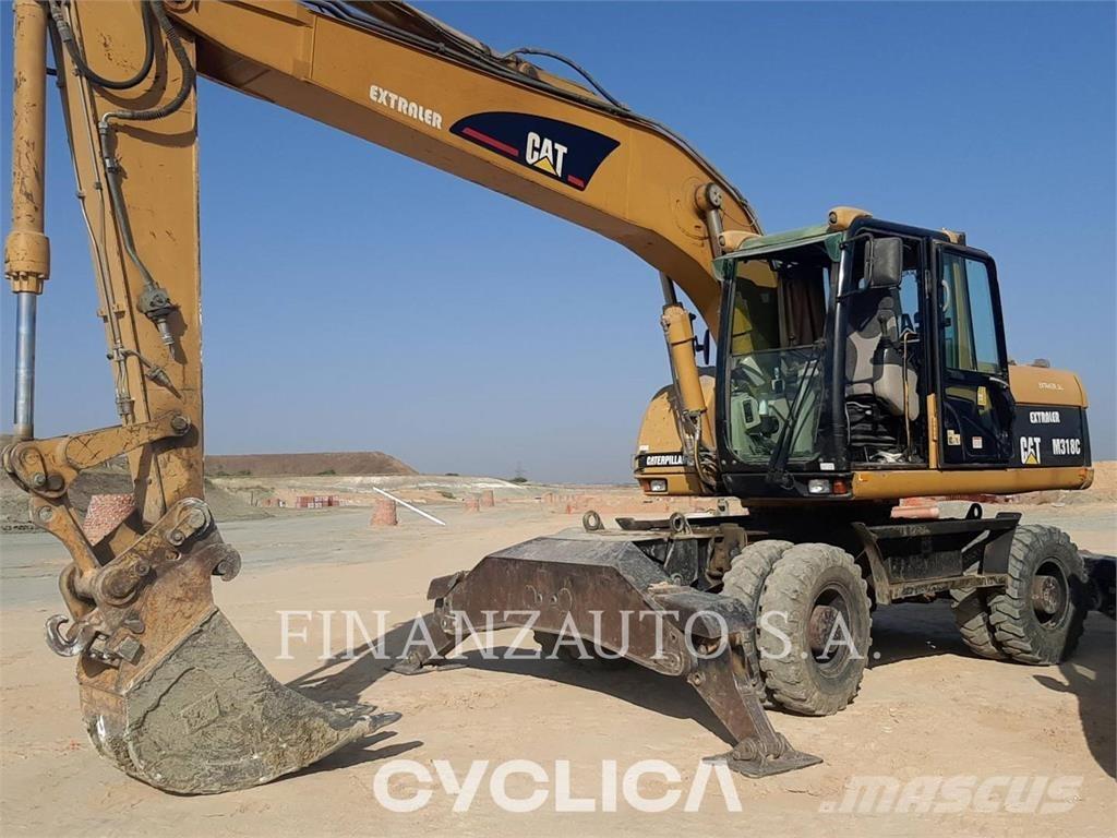 CAT M318 Escavatori gommati