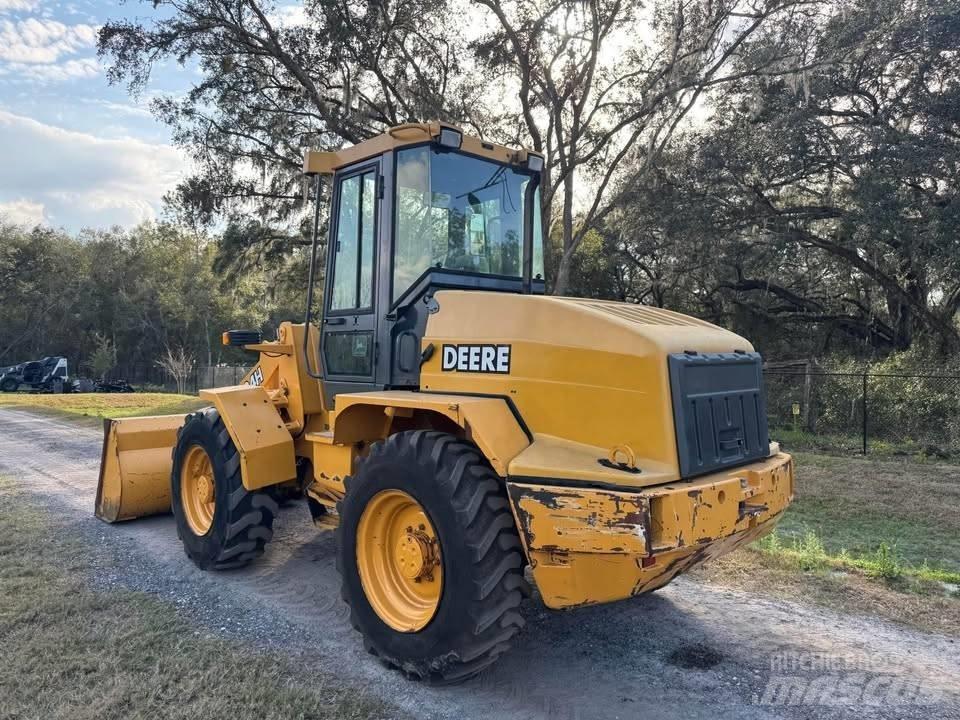 John Deere 324h Pale gommate