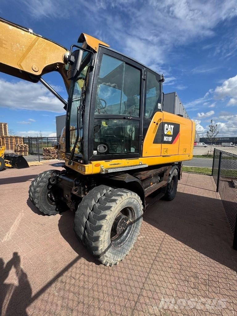 CAT 318 Escavatori gommati