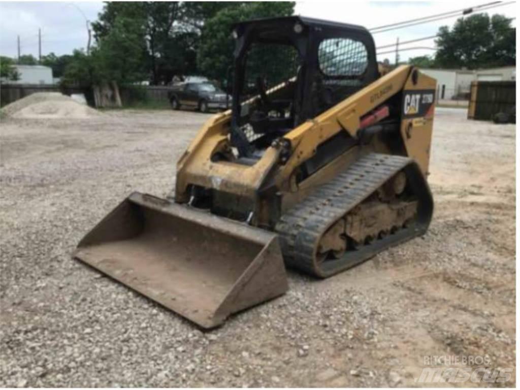 CAT 279D Mini Pale Gommate