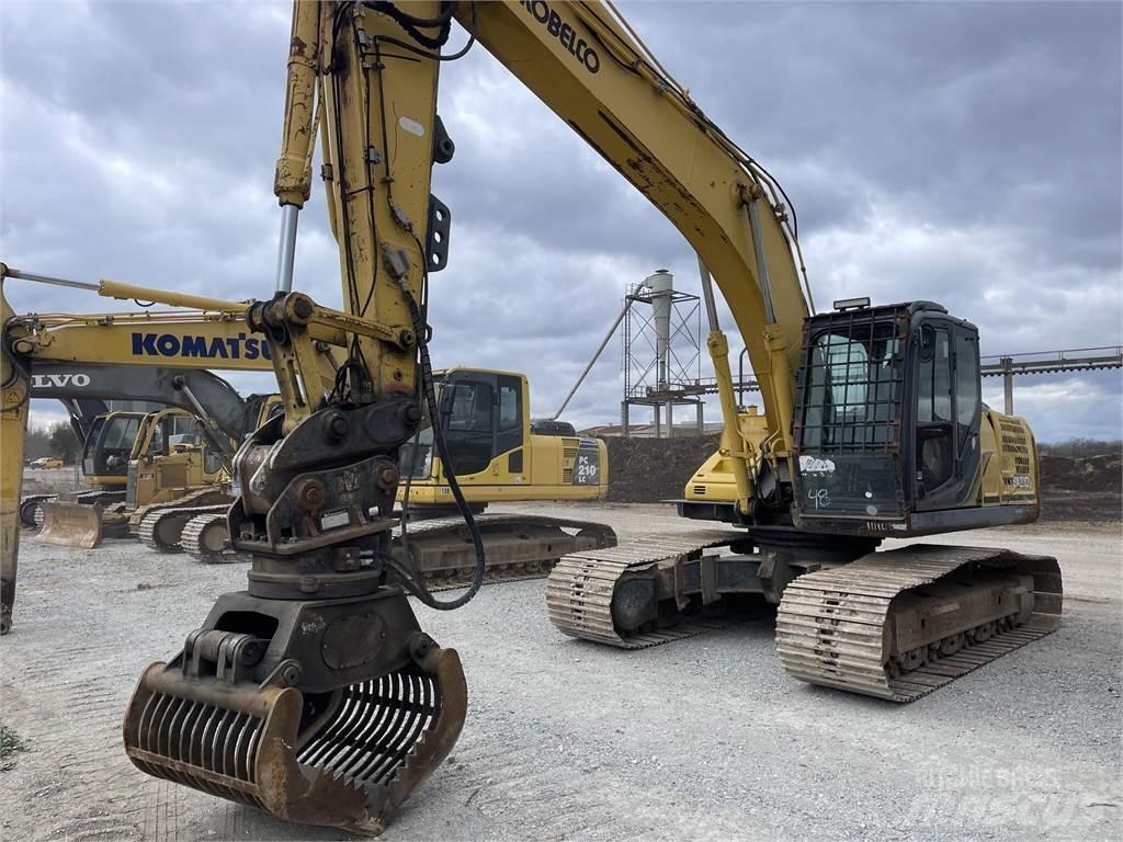 Kobelco SK210 LC-9 Caricatronchi con base su rimorchio
