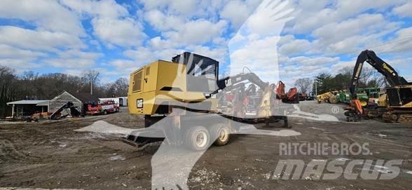 CAT 559C Caricatronchi con base su rimorchio