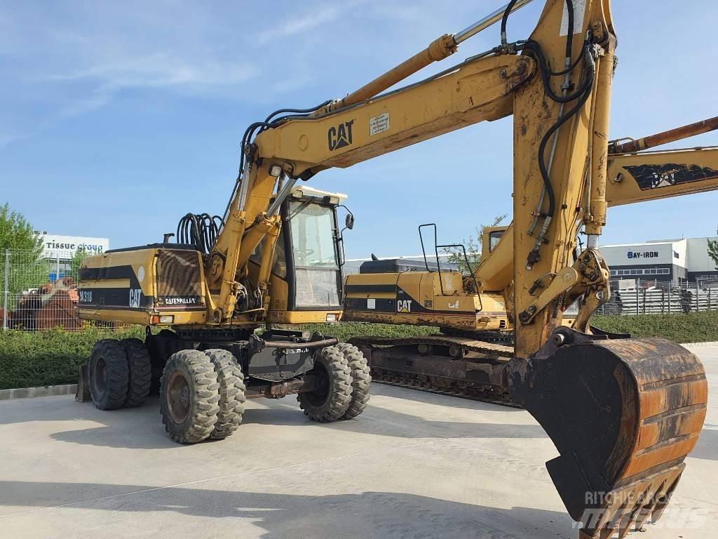 CAT M 318 Escavatori gommati