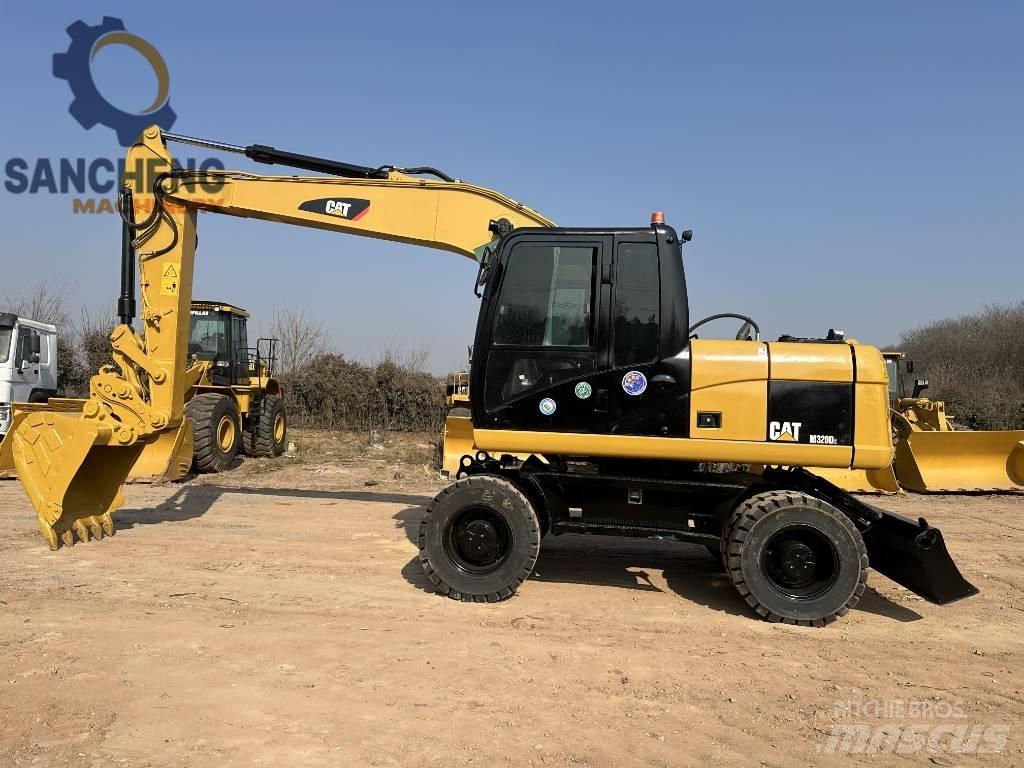 CAT M 320 D2 Escavatori gommati