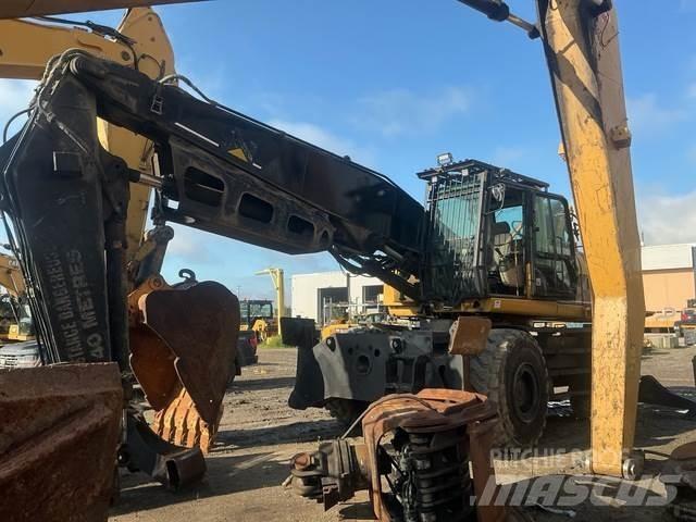 CAT M325CMH Caricatronchi con base su rimorchio