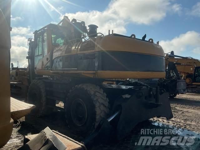 CAT M325CMH Caricatronchi con base su rimorchio