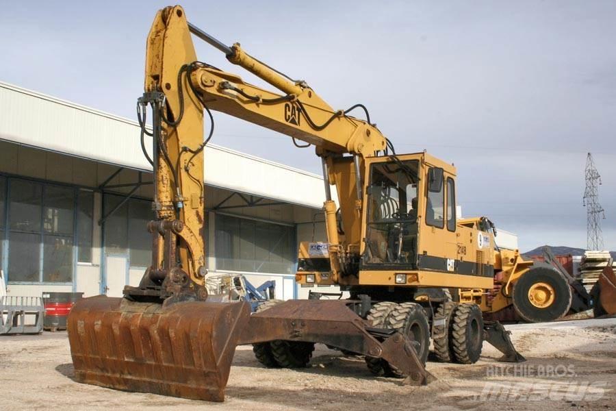 CAT 214B Escavatori gommati