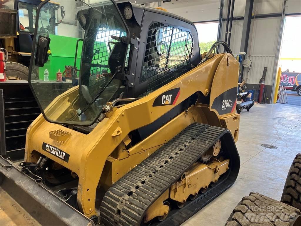 CAT 279C Mini Pale Gommate