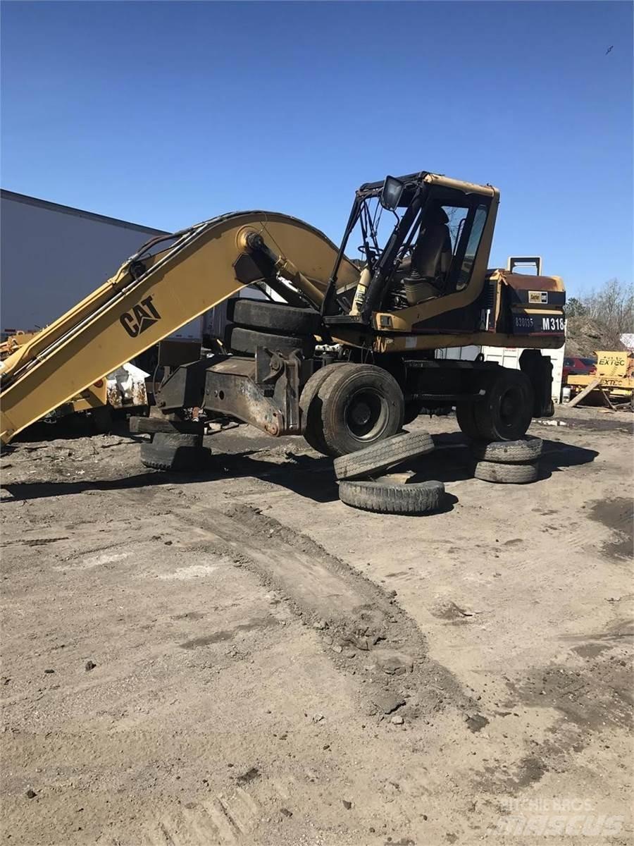 CAT M318 Escavatori gommati