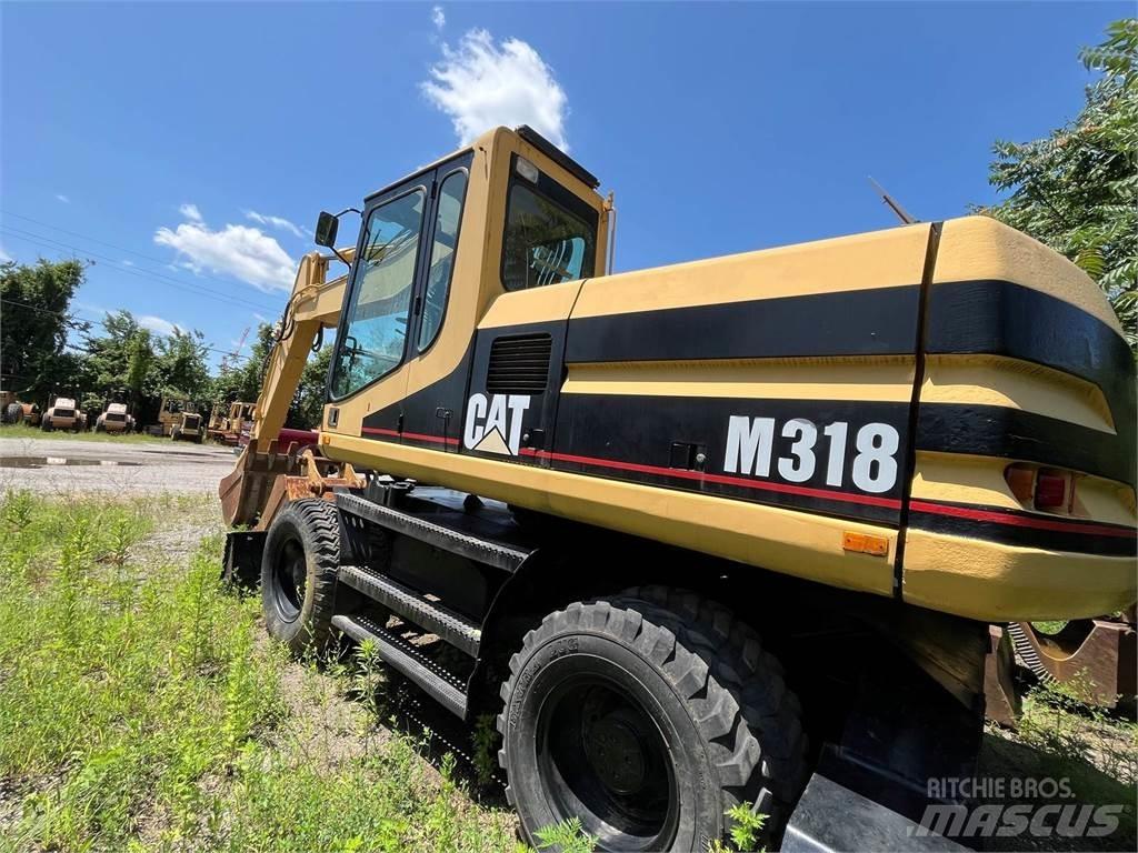CAT M318 Escavatori gommati