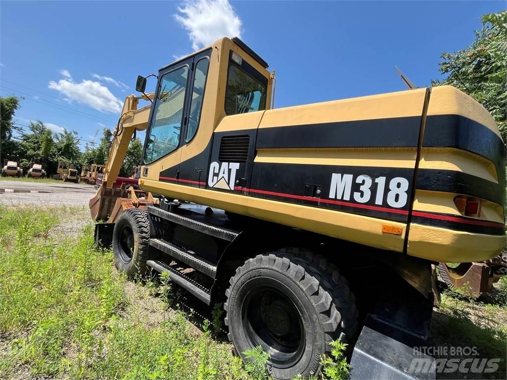 CAT M318 Escavatori gommati