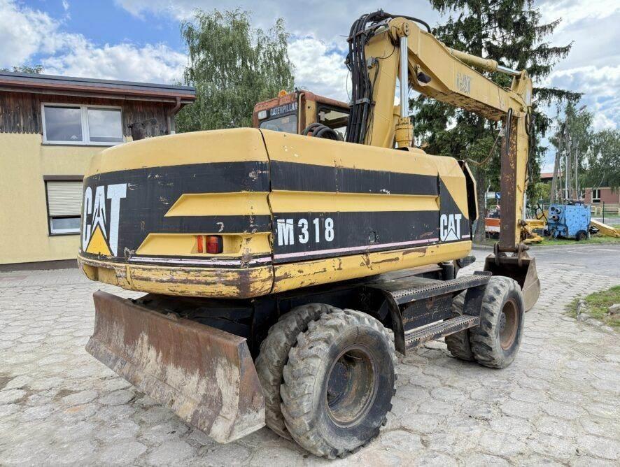 CAT M318 Escavatori gommati