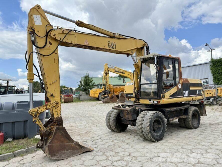 CAT M318 Escavatori gommati